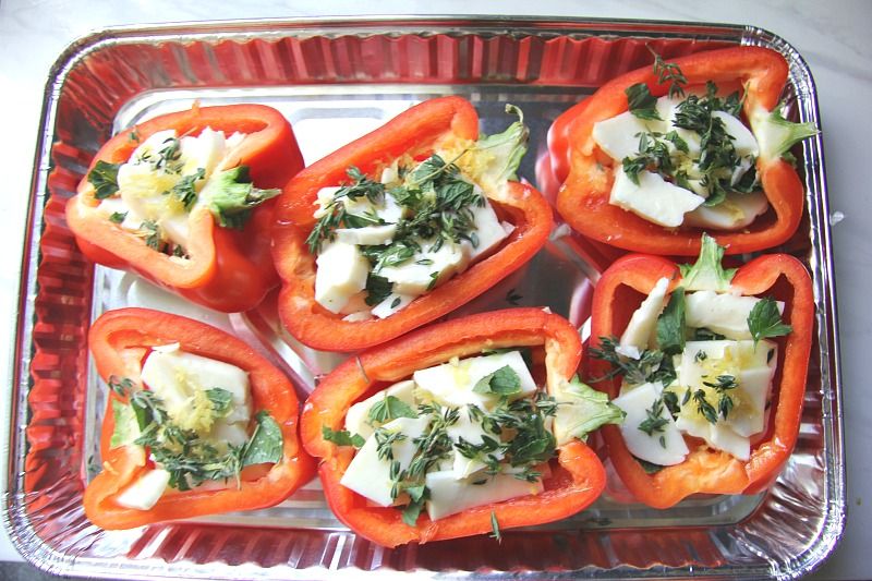 red peppers stuffed with halloumi on a silver tray