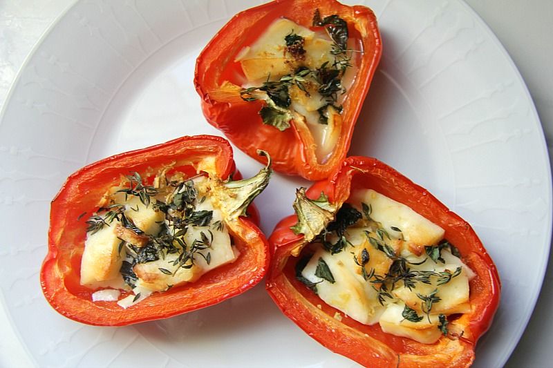 cooked stuffed red peppers on a plate