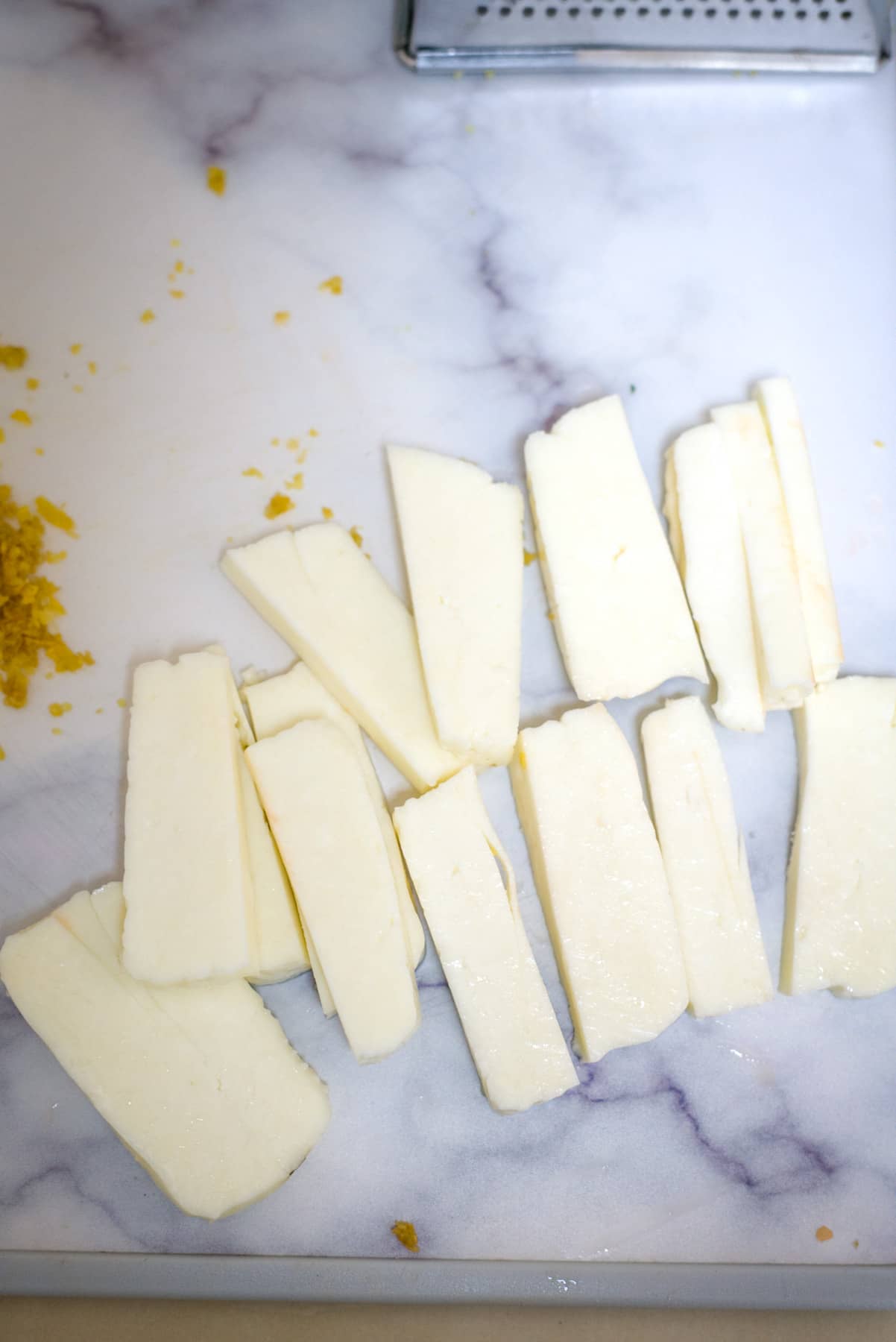 sliced halloumi cheese on a board