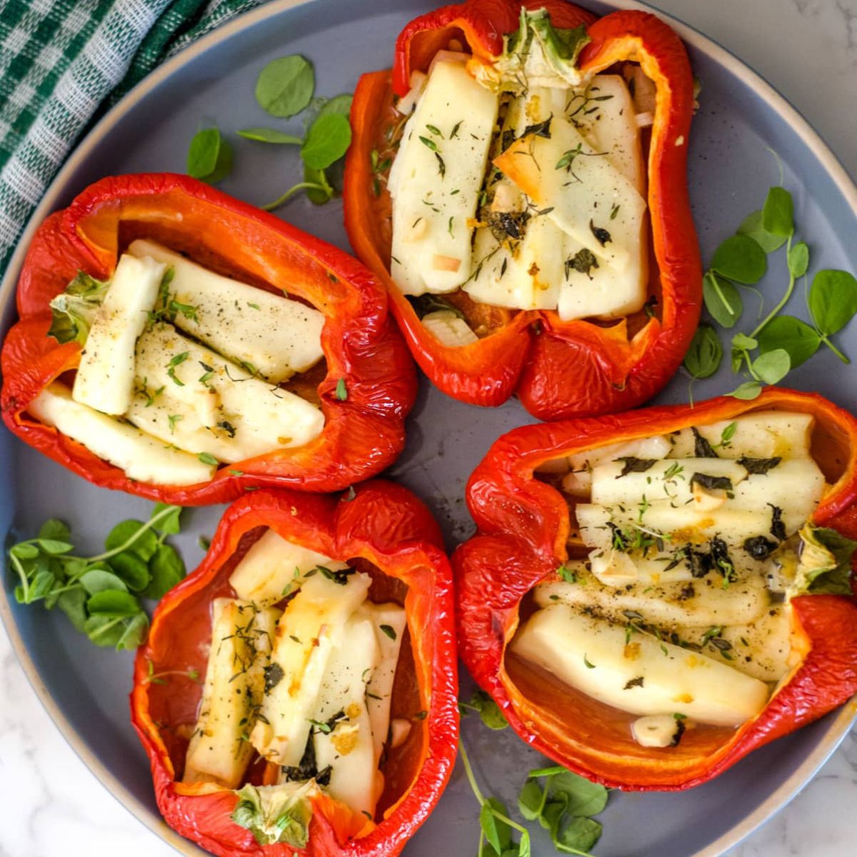stuffed red bell peppers on a plate