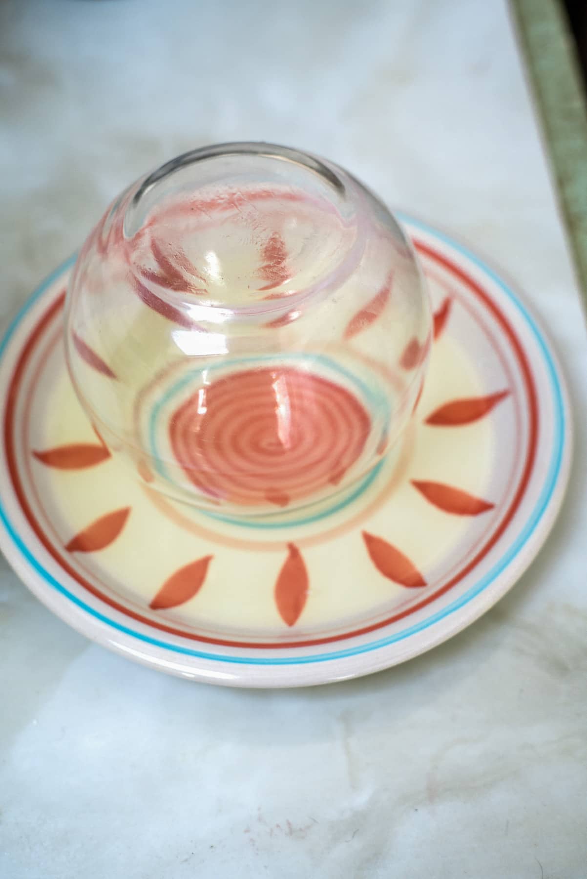 circular glass in a plate of lime juice