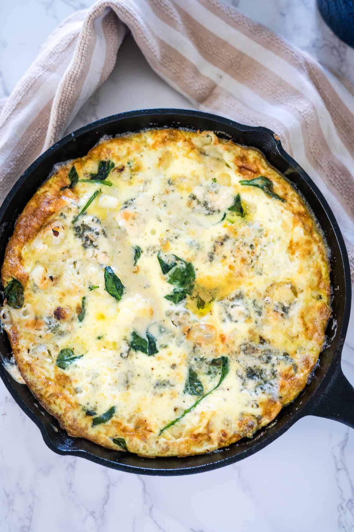 A skillet filled with a frittata.
