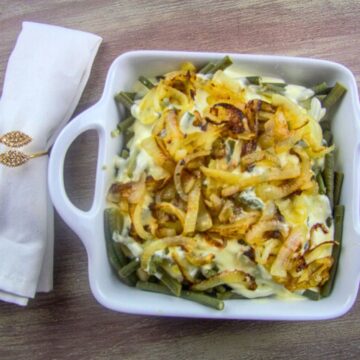 Green bean casserole with onions and cheese.
