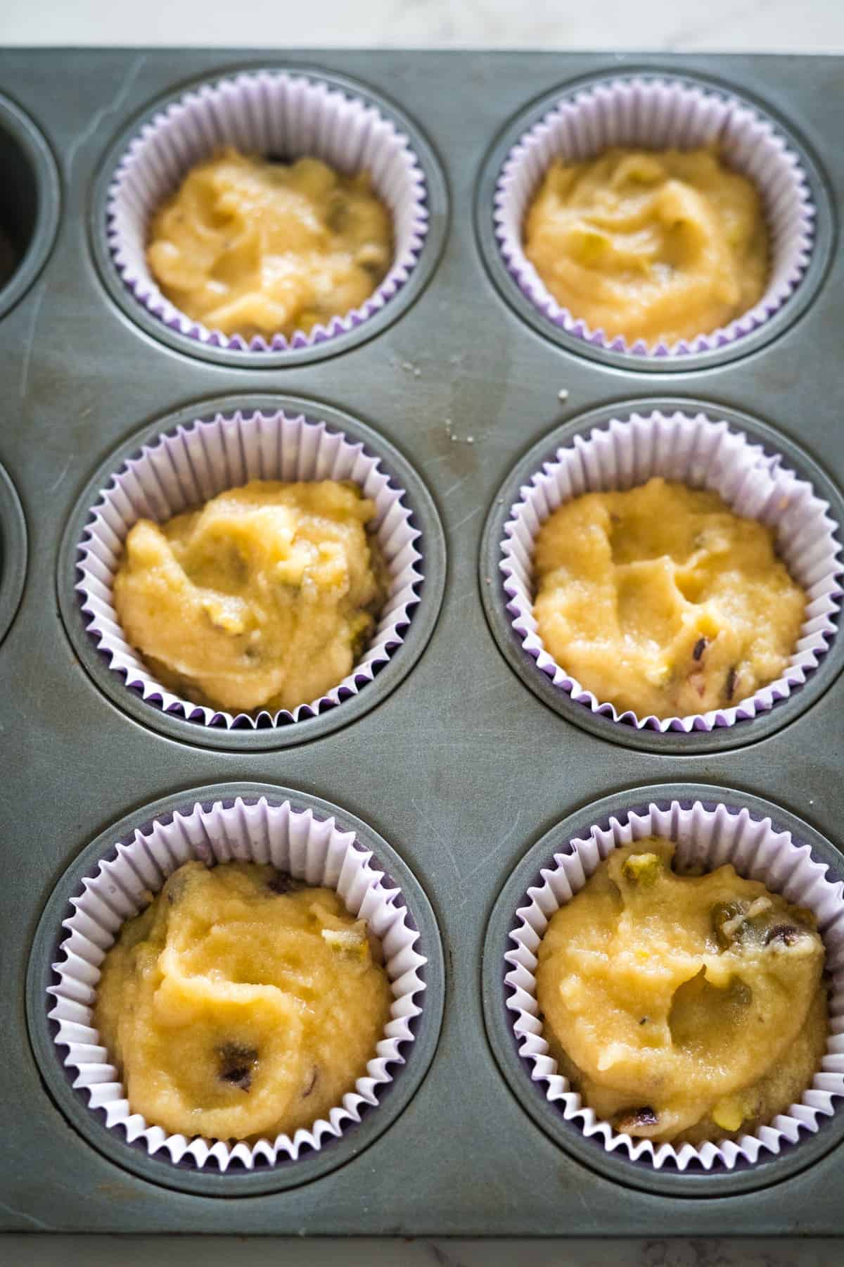 Muffins in a pistachio muffin tin.