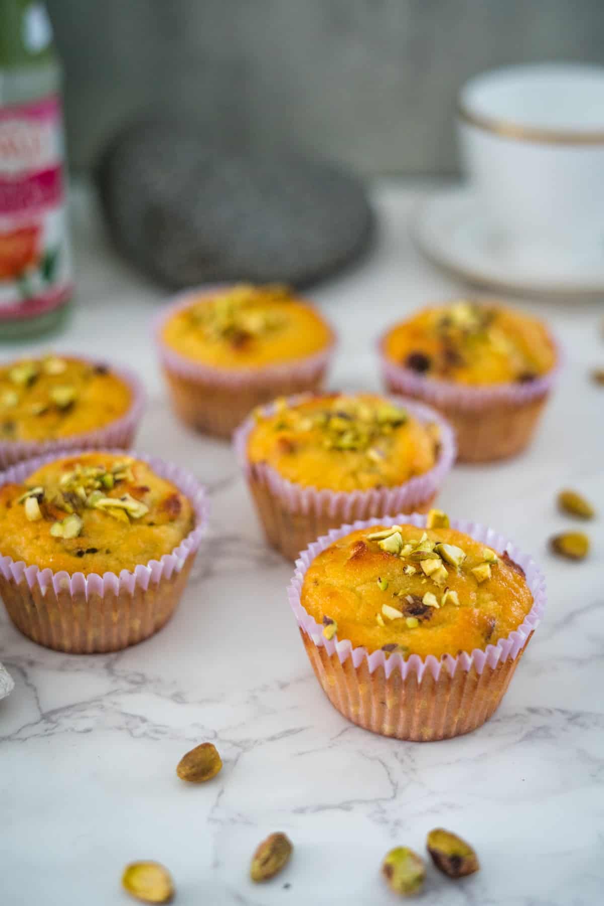 A group of pistachio muffins.
