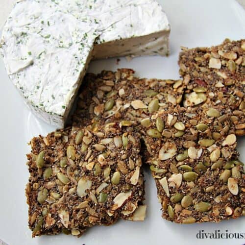Low carb granola bars with seeds and cheese on a plate.