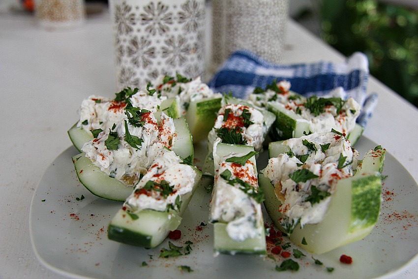 A plate with sliced cucumber bites.