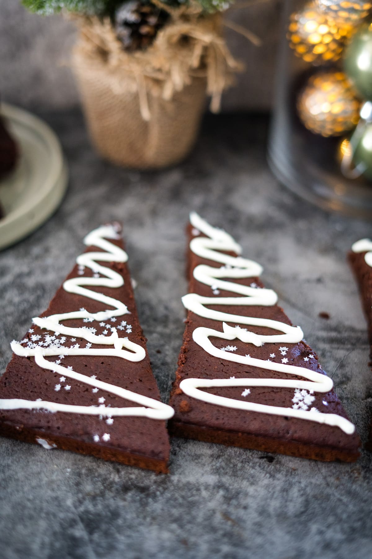 Spiced chocolate Christmas cookies with white icing.