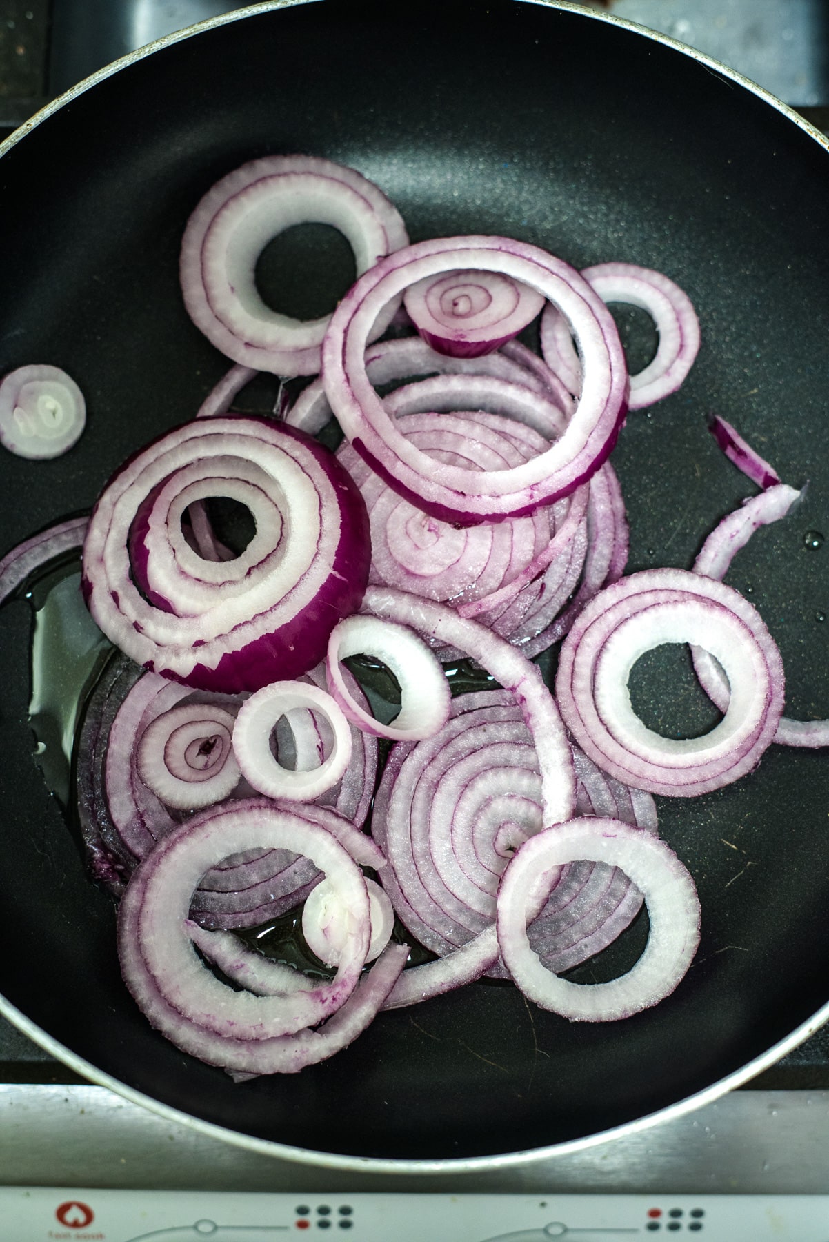 red onion rings in pan