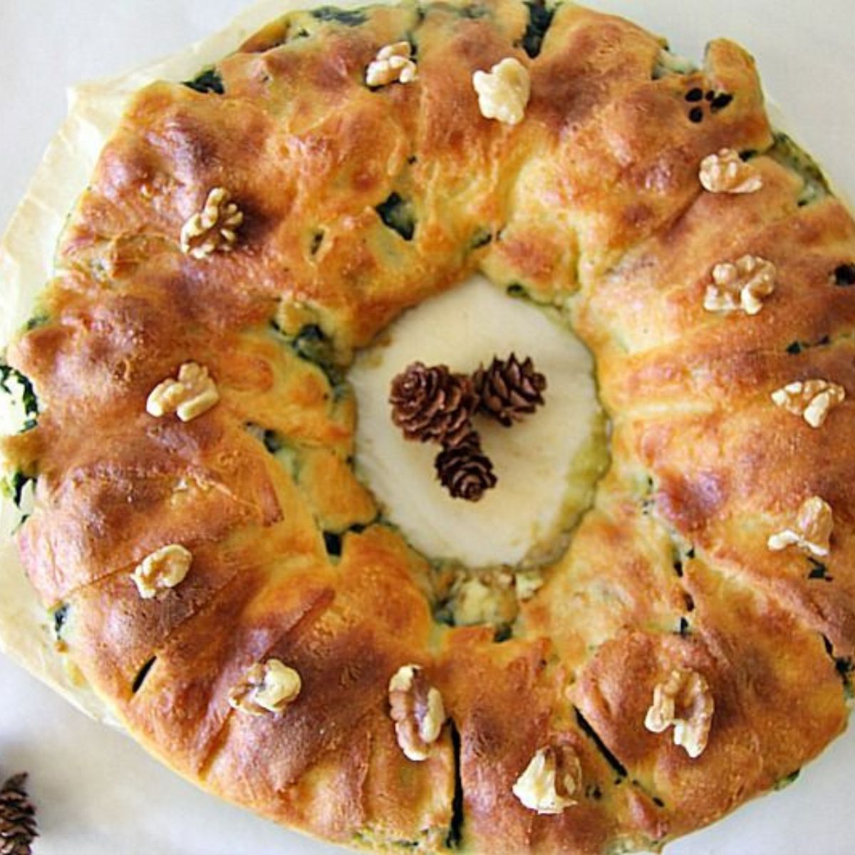 A wreath made with spinach and walnuts.
