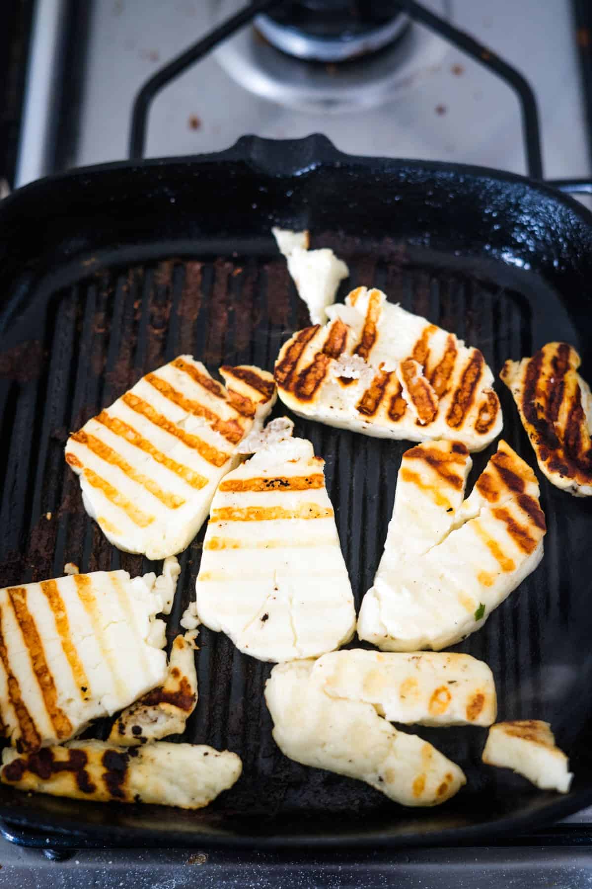 Grilled tofu in a avocado frying pan.