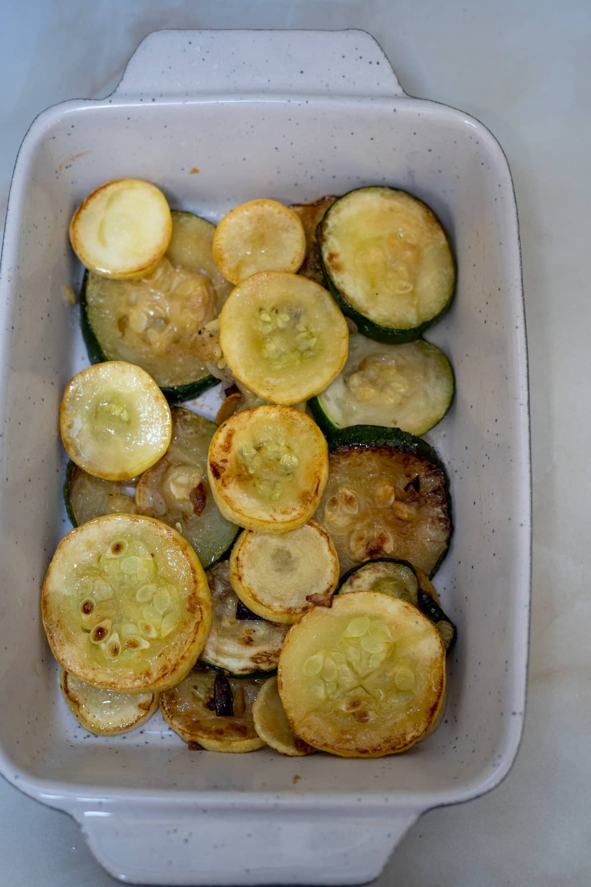 cooked zucchini in baking dish.