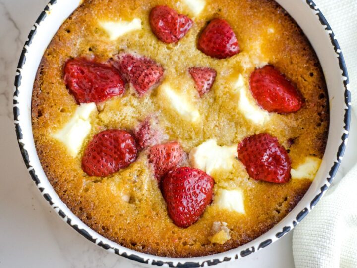 strawberry cobbler in a circular dish