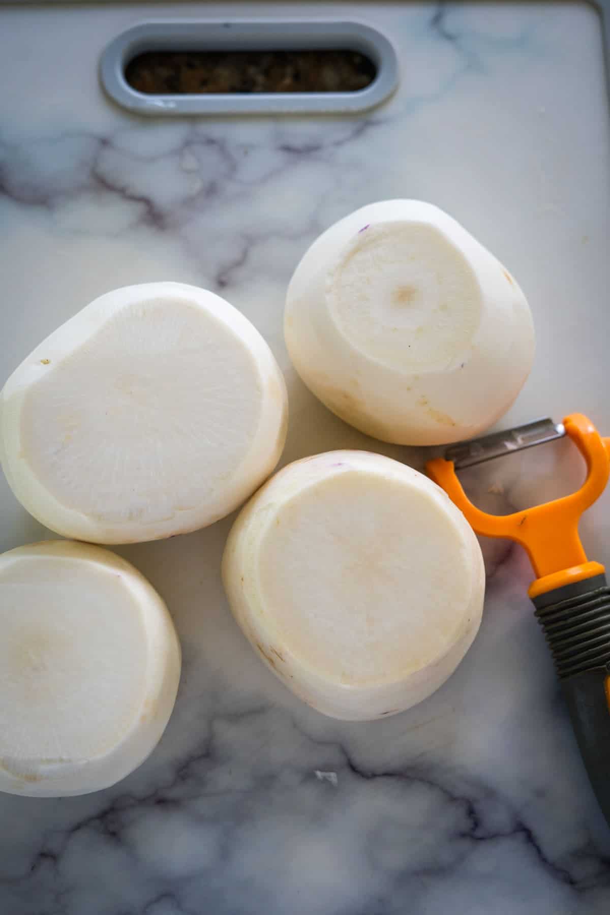 A cutting board with keto turnips on it.