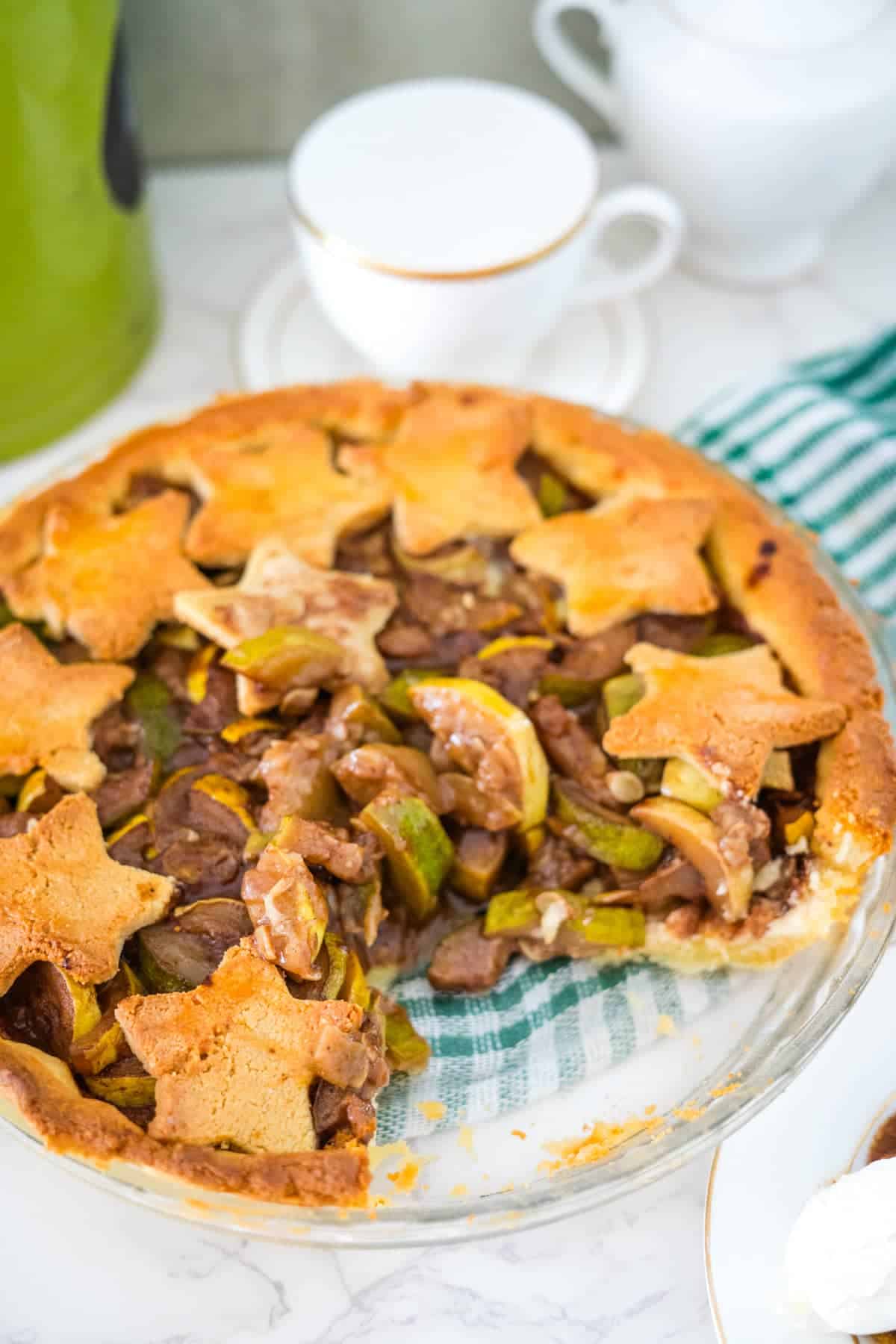 A savory pie with meat and vegetables on a plate.