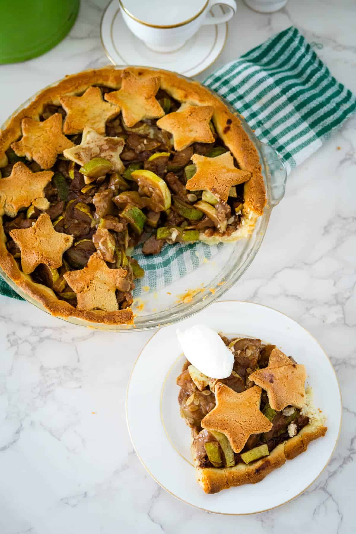 A keto apple pie on a plate with a slice taken out.