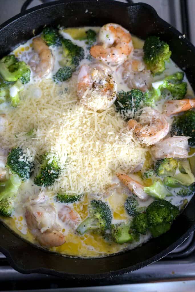 cheese on shrimp and broccoli