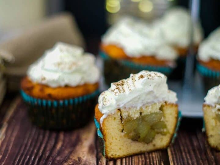 Apple pie muffins with whipped cream and cinnamon sugar.