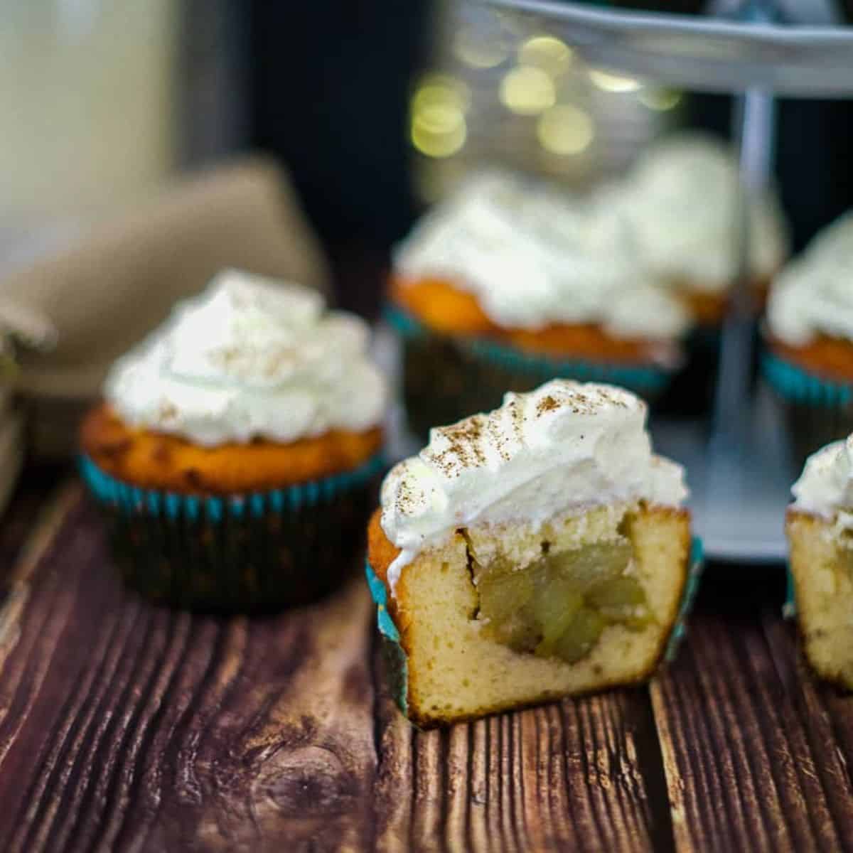 Apple pie muffins with whipped cream and cinnamon sugar.