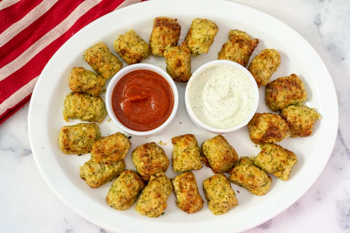 broccoli tots on a plate with dips