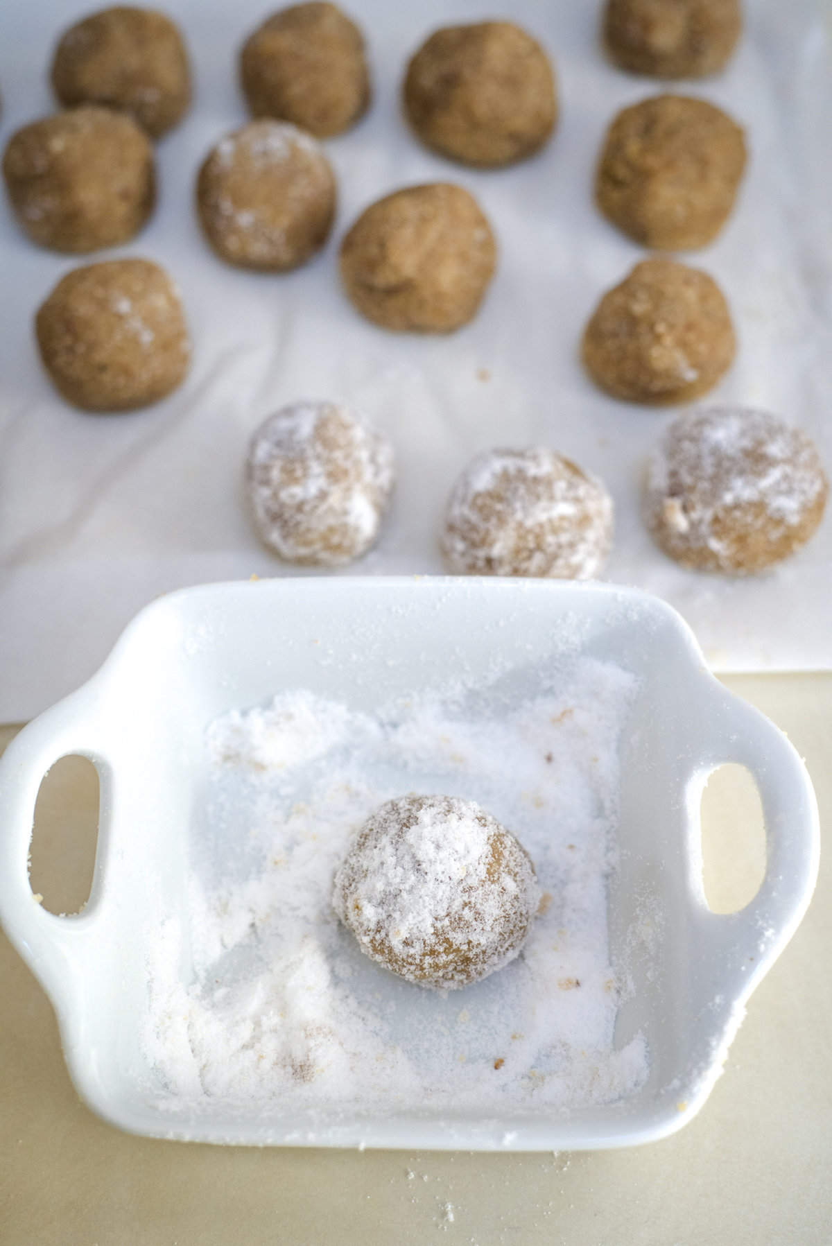 roll cookies in powdered sweetener