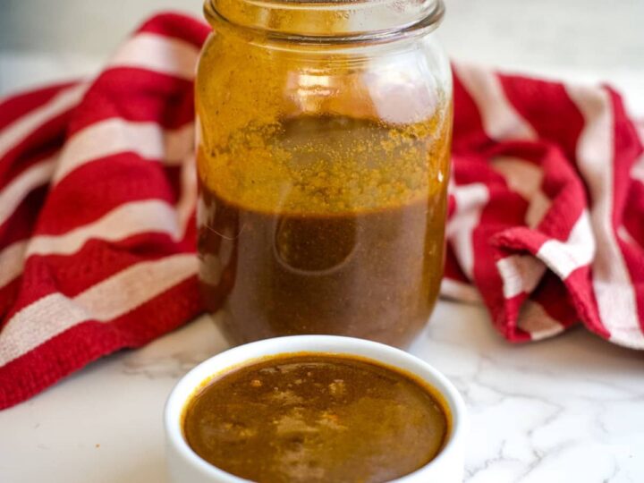 enchilada sauce in a glass jar and small serving dish