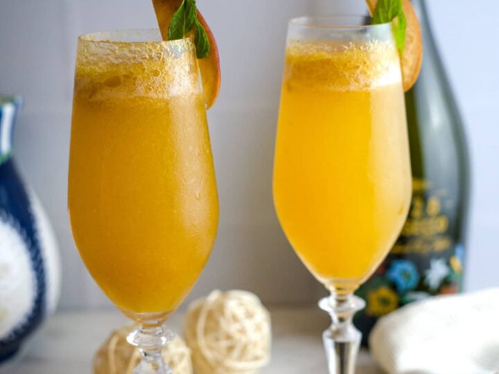 two tall glasses of peach bellini