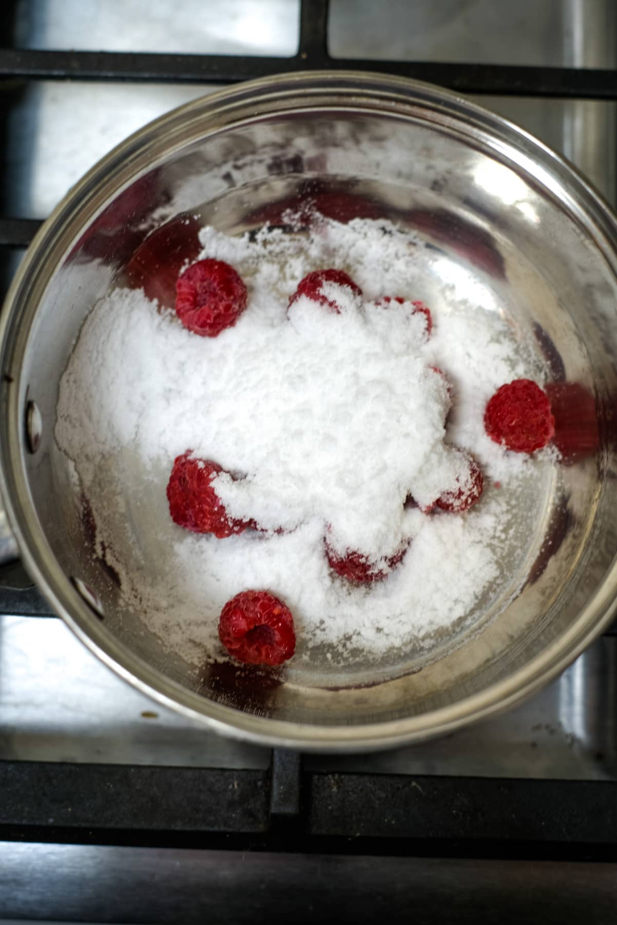 raspberries and sweetener in a saucepan