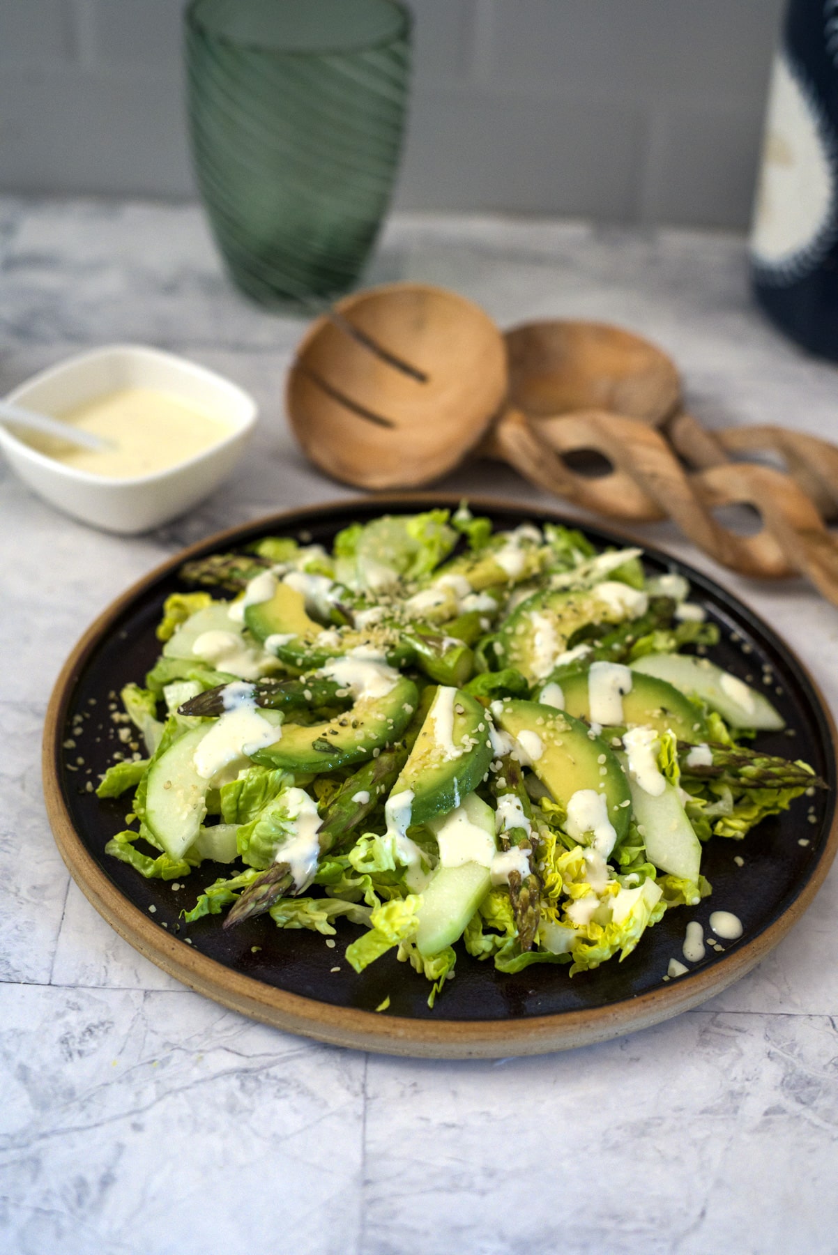 slices of avocado asparagus and cucumber on a plate