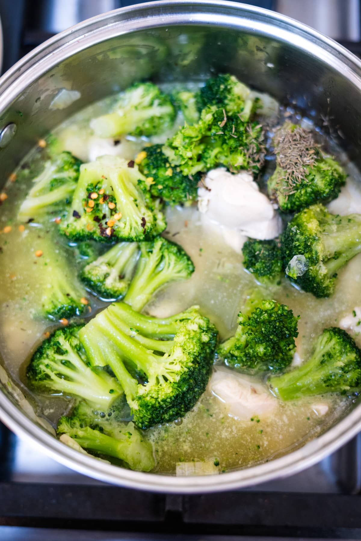 A pot of broccoli soup on the stove.