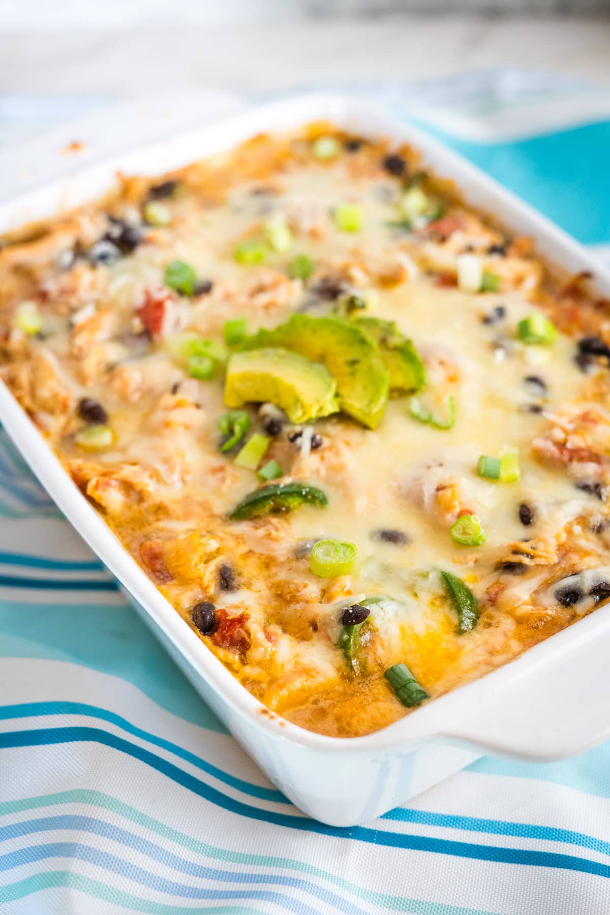 A casserole dish with cheese and vegetables.
