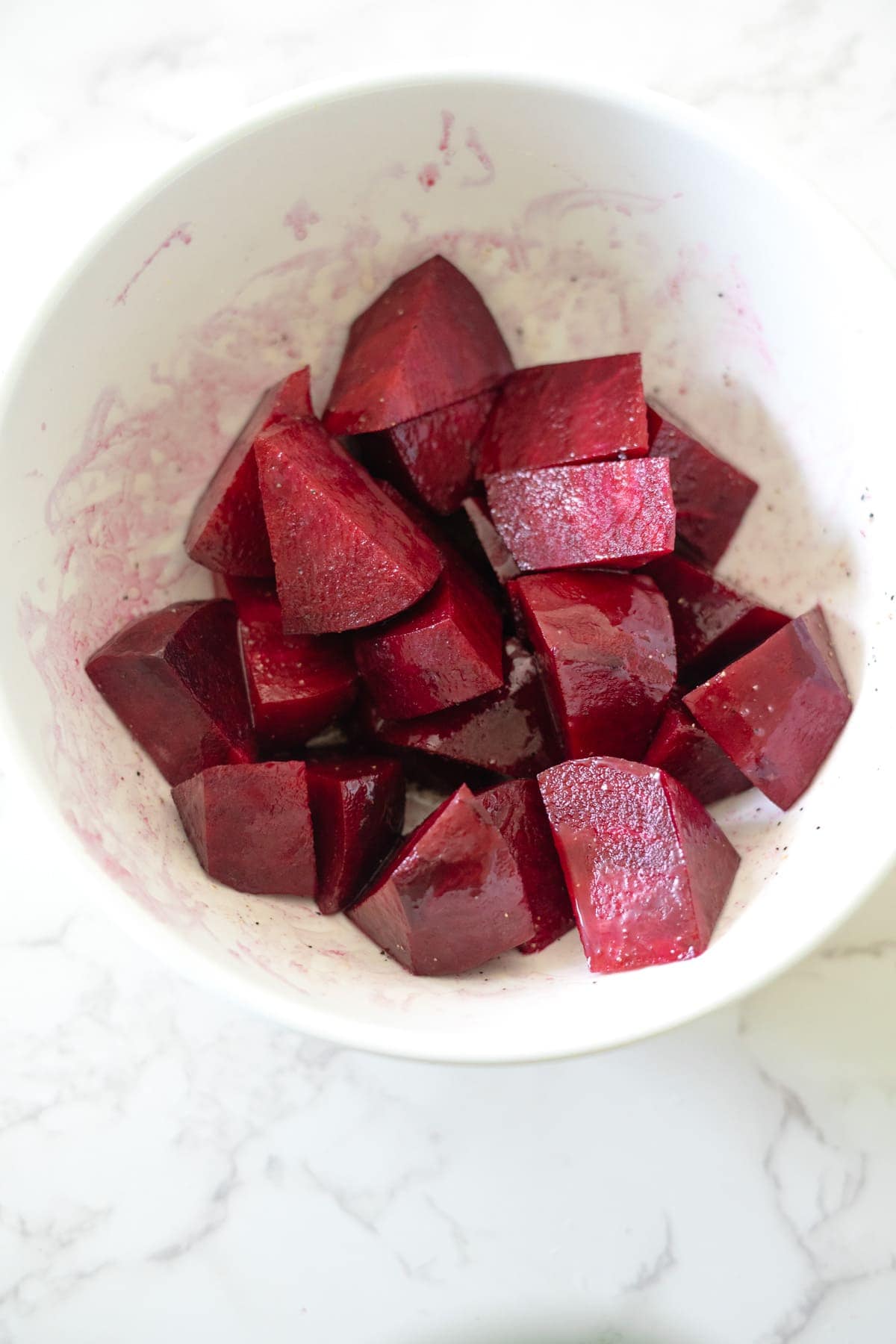 Air fryer roasted beets in a white bowl.