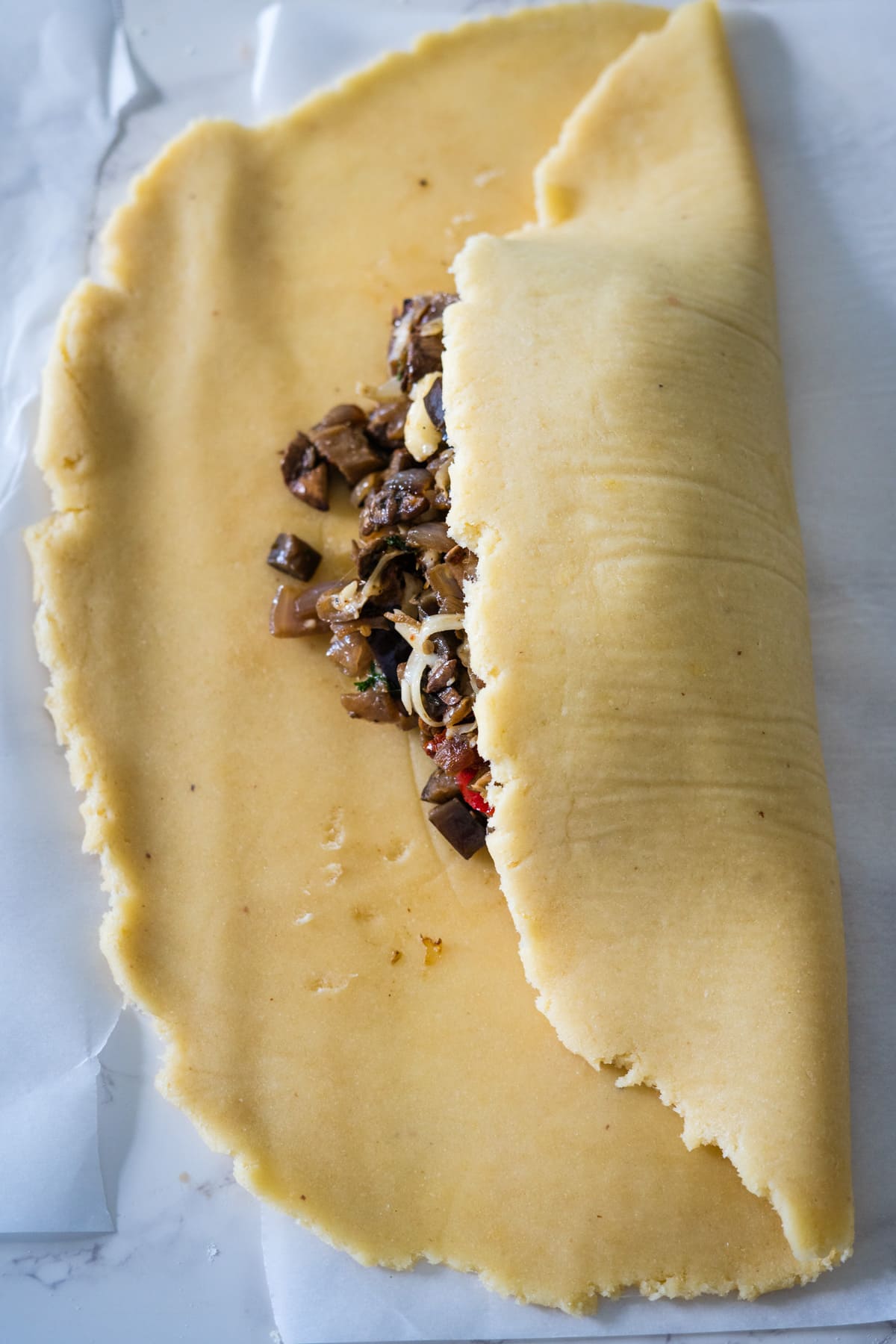 A vegetable wellington - a piece of dough with a filling on it that combines savory vegetables.