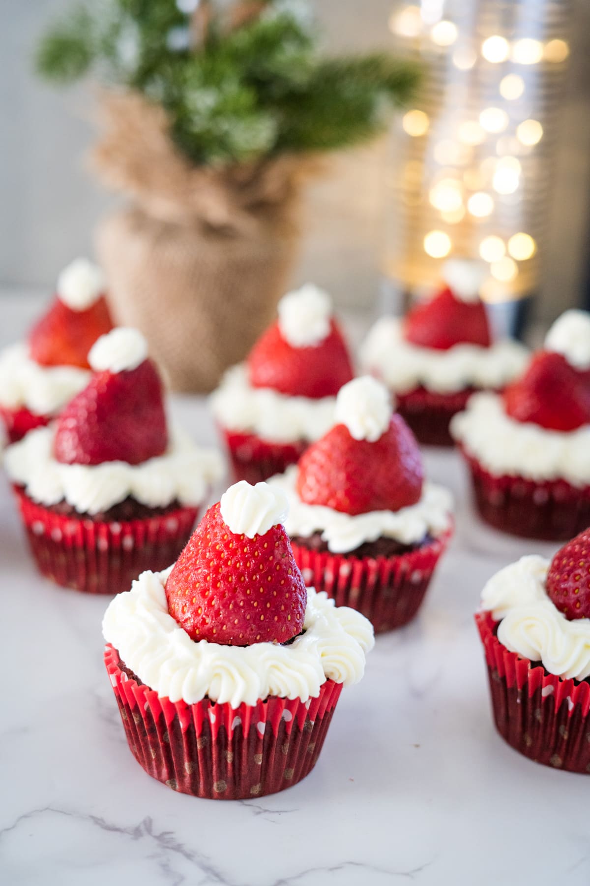 Indulge in these delectable chocolate Santa hat cupcakes.