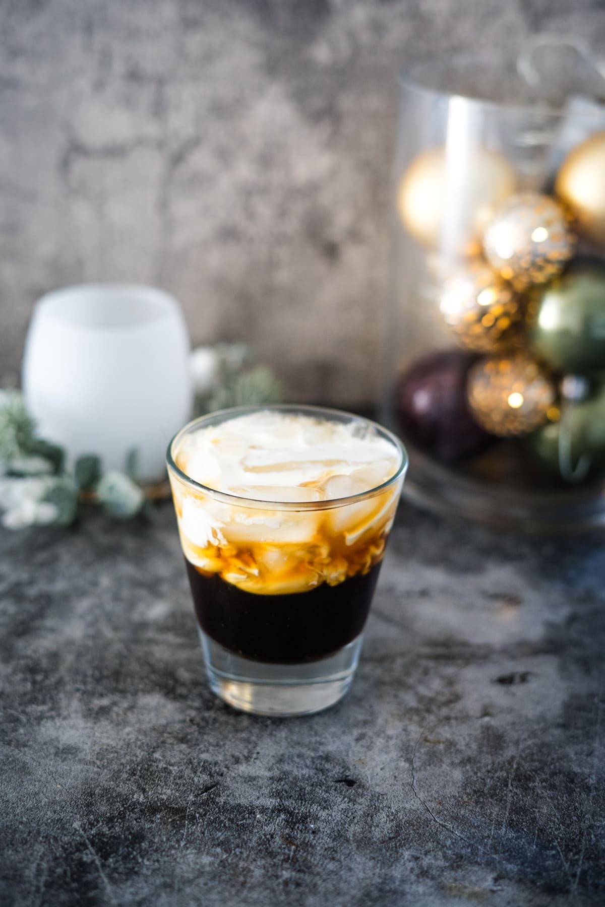 A keto white russian adorned with festive christmas ornaments.