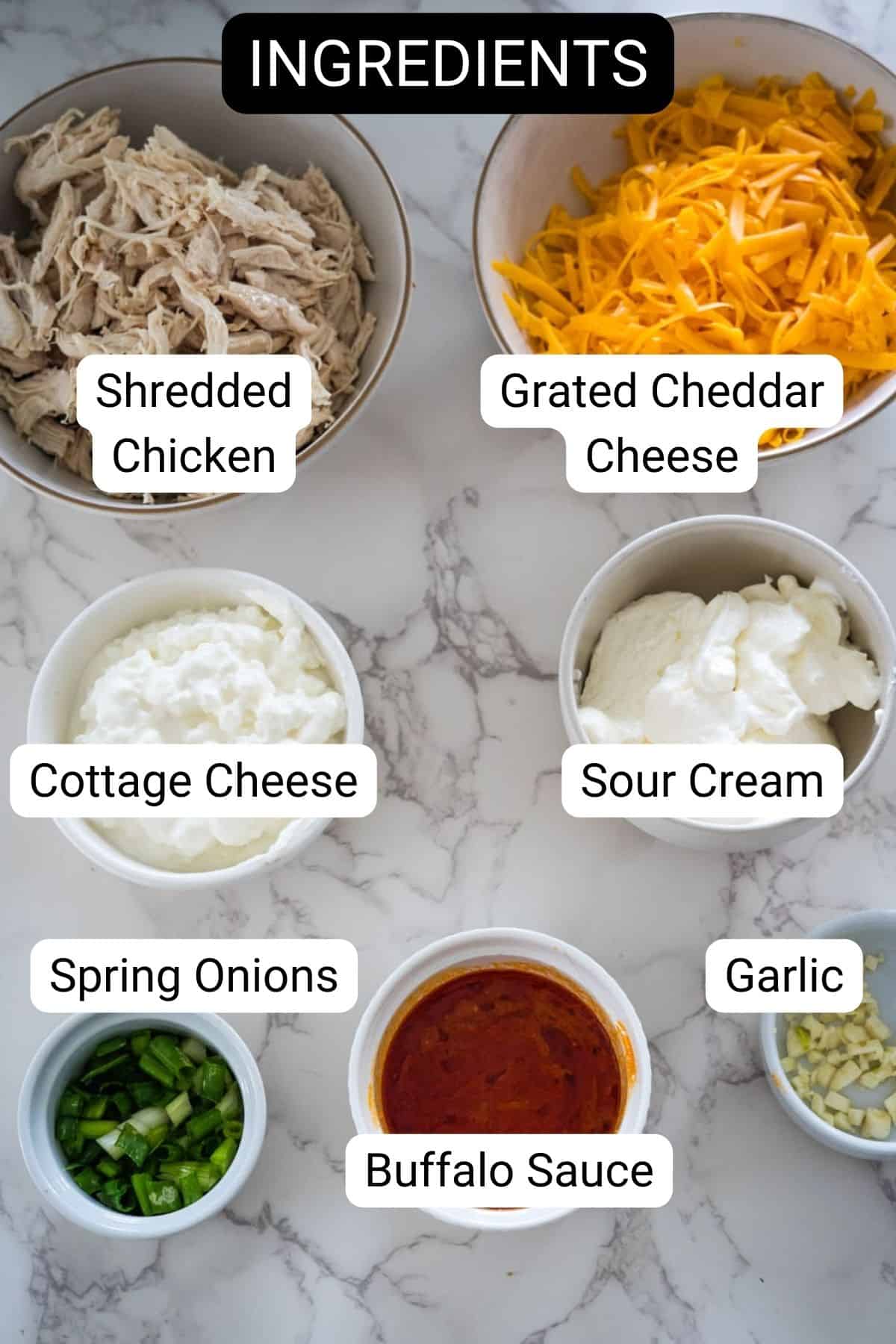 A bowl of ingredients for buffalo chicken dip.