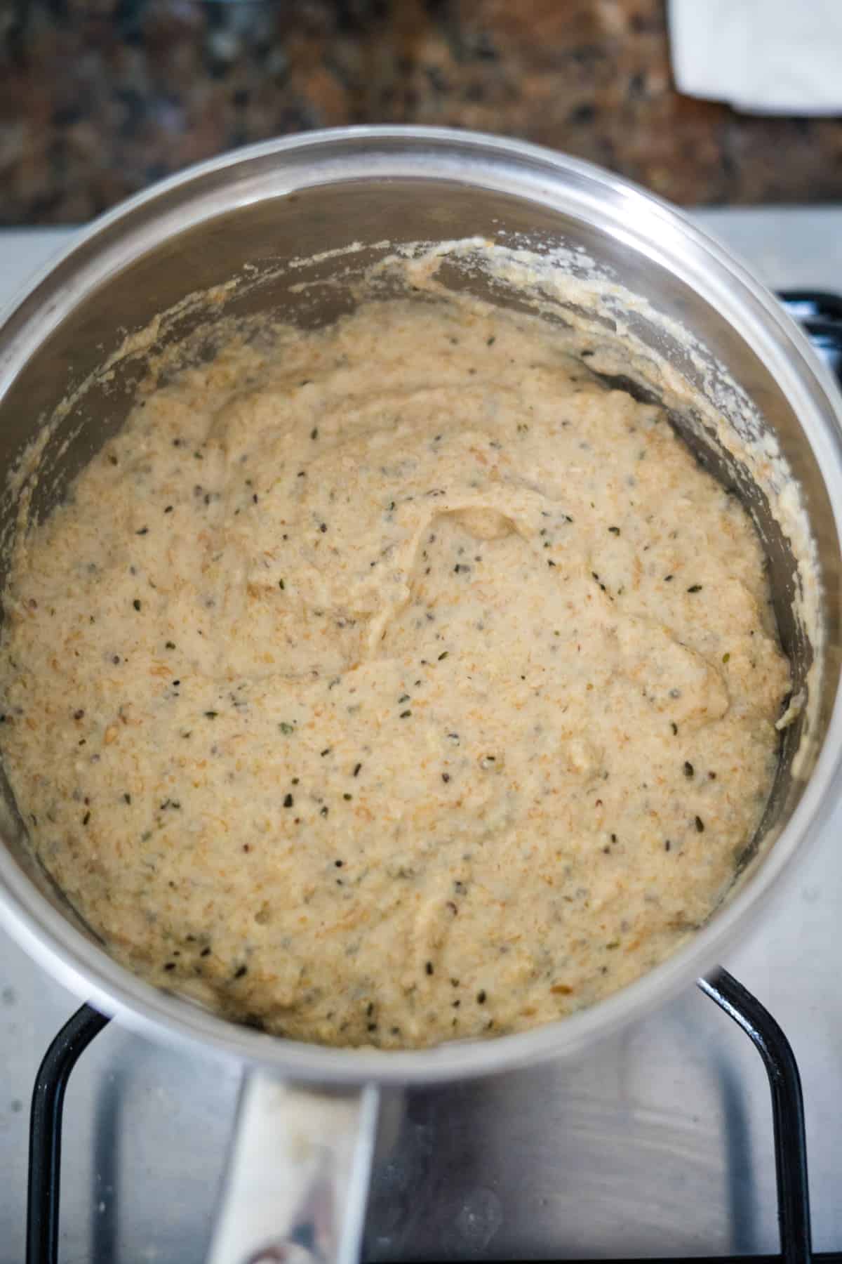 A protein-rich porridge simmering on a stove.