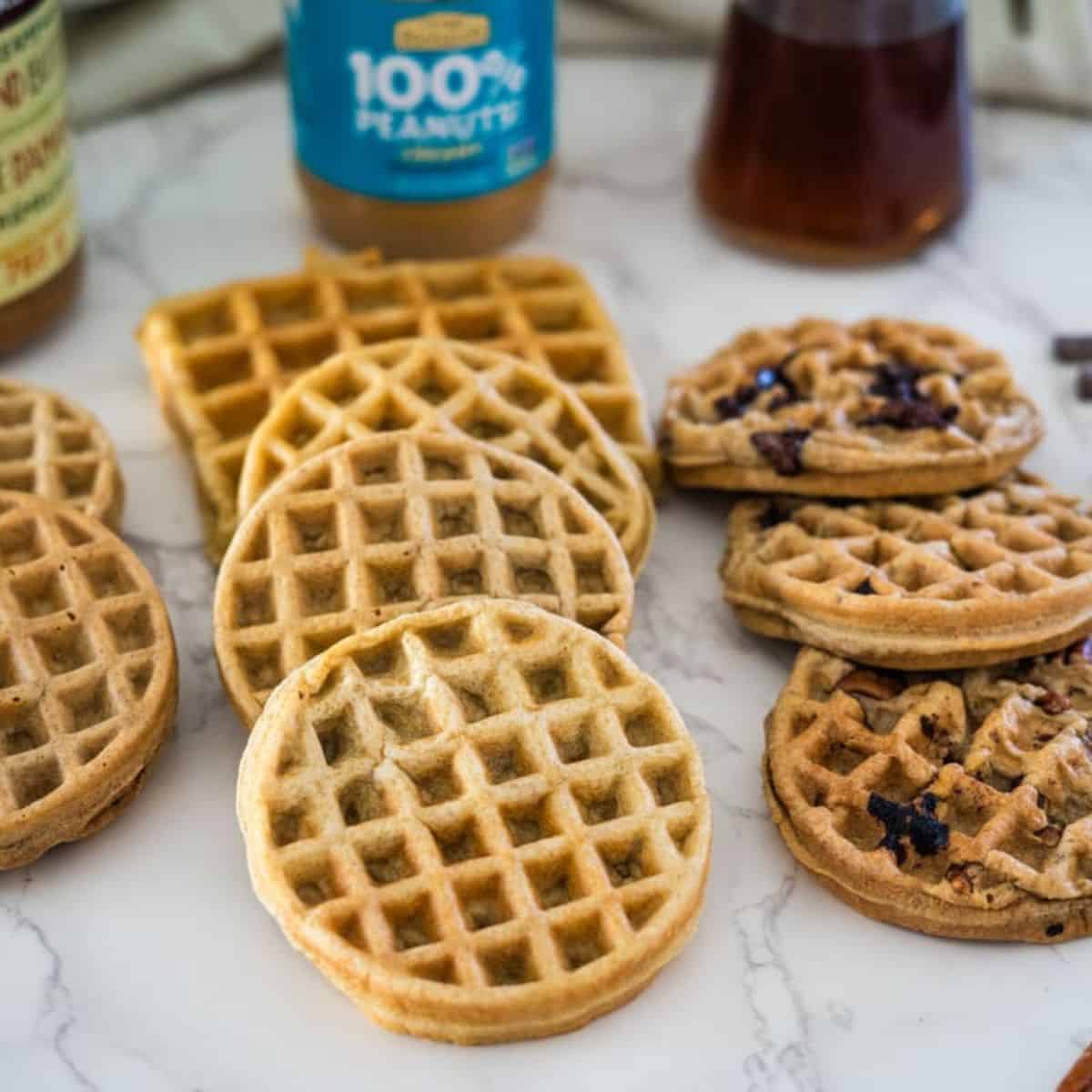 Peanut butter waffles on a white plate.