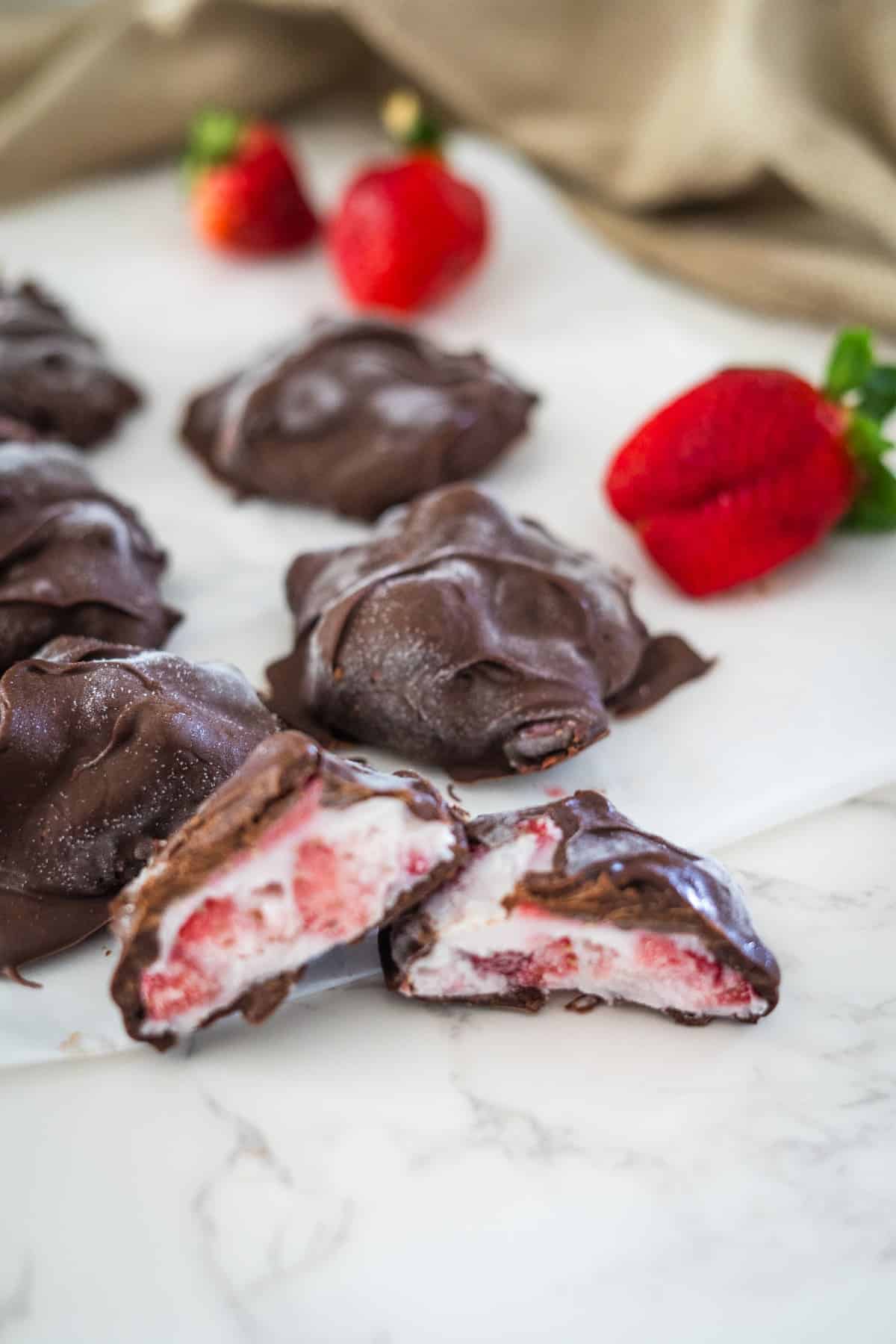Indulge in decadent chocolate covered strawberries atop a white plate.