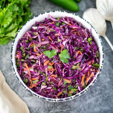 Red cabbage slaw in a bowl.