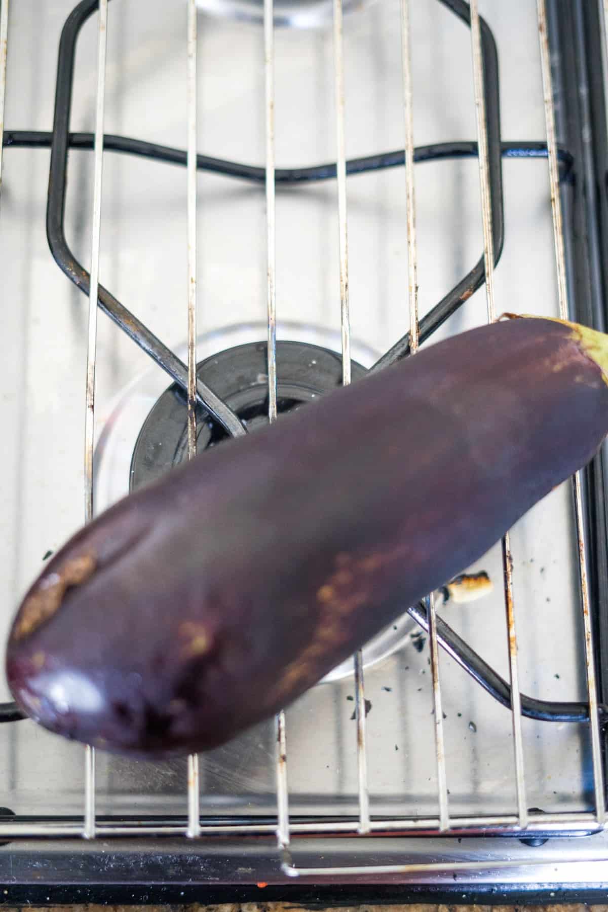 A Mutabal eggplant on a stove.