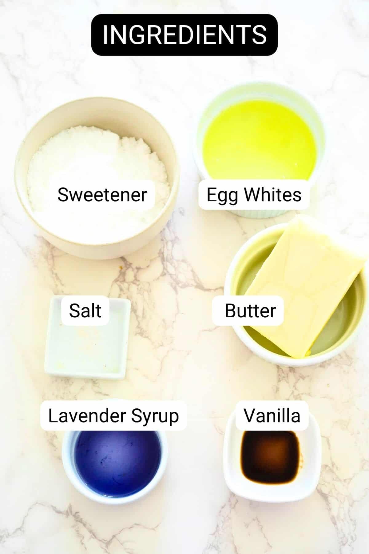 Ingredients laid out in bowls: sweetener, egg whites, salt, butter, lavender syrup, and vanilla for delightful lemon lavender cupcakes.