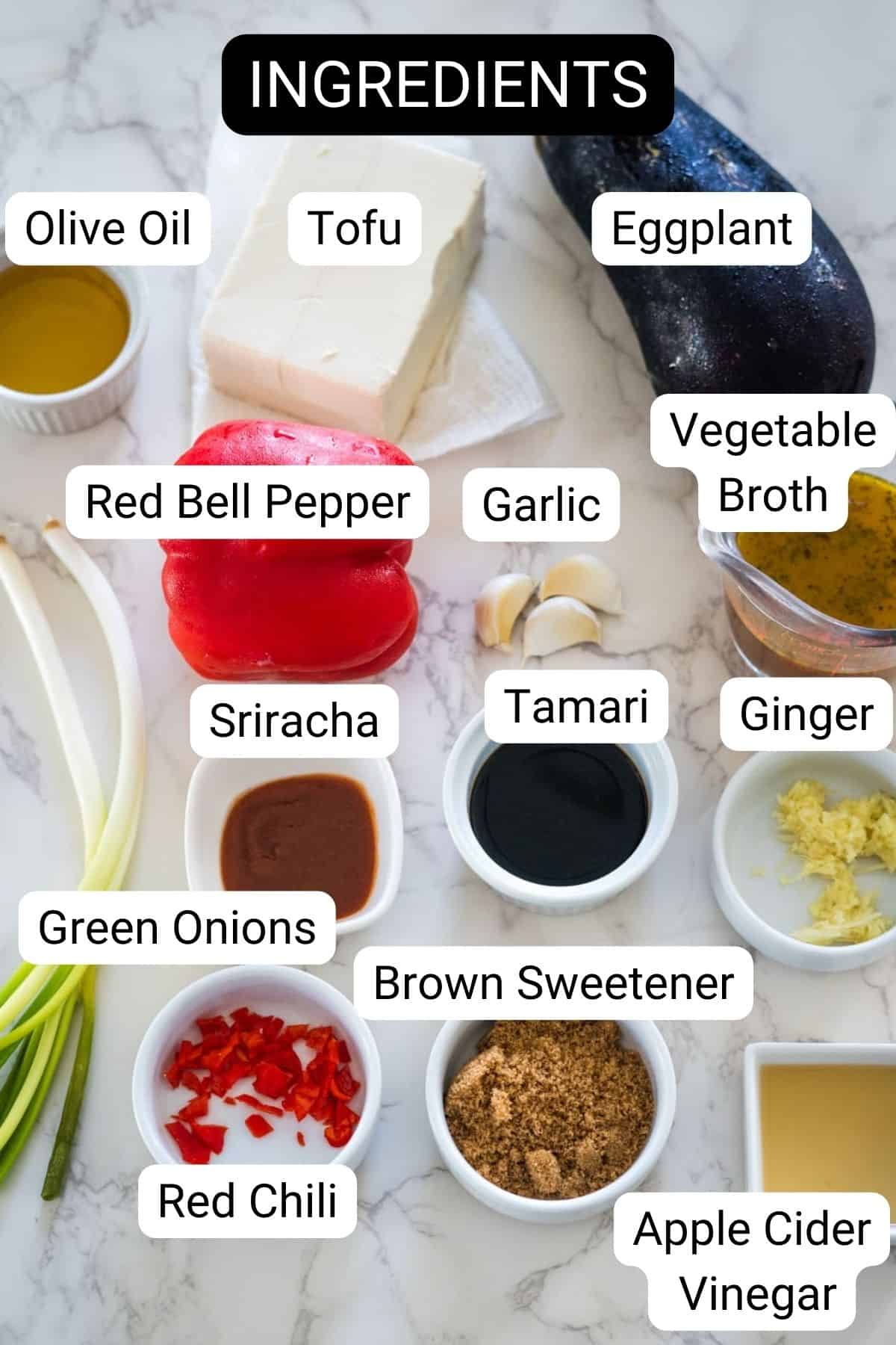 A variety of labeled ingredients including olive oil, tofu, eggplant, vegetable broth, red bell pepper, garlic, ginger, tamari, sriracha, brown sweetener, green onions, red chili, and apple cider vinegar.