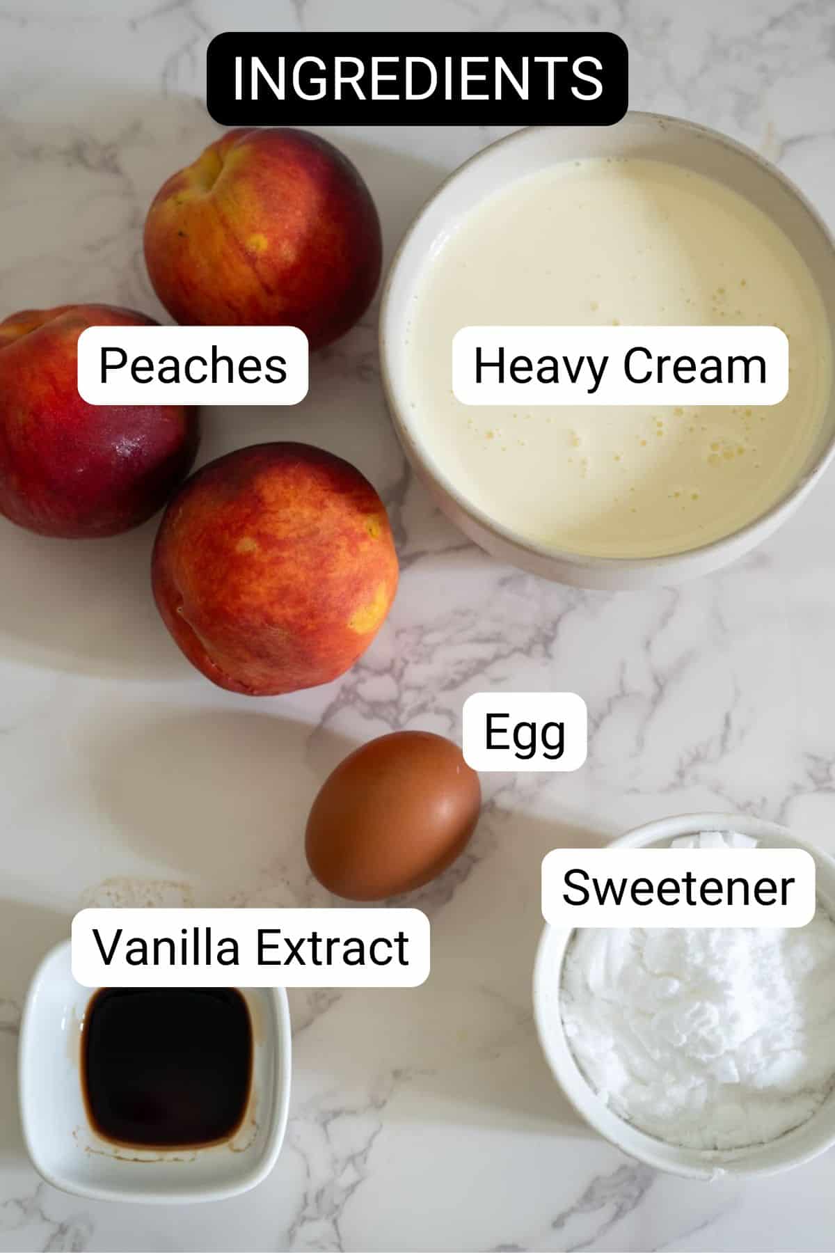 Ingredients include peaches, heavy cream, an egg, vanilla extract, and sweetener, all arranged on a marble surface.