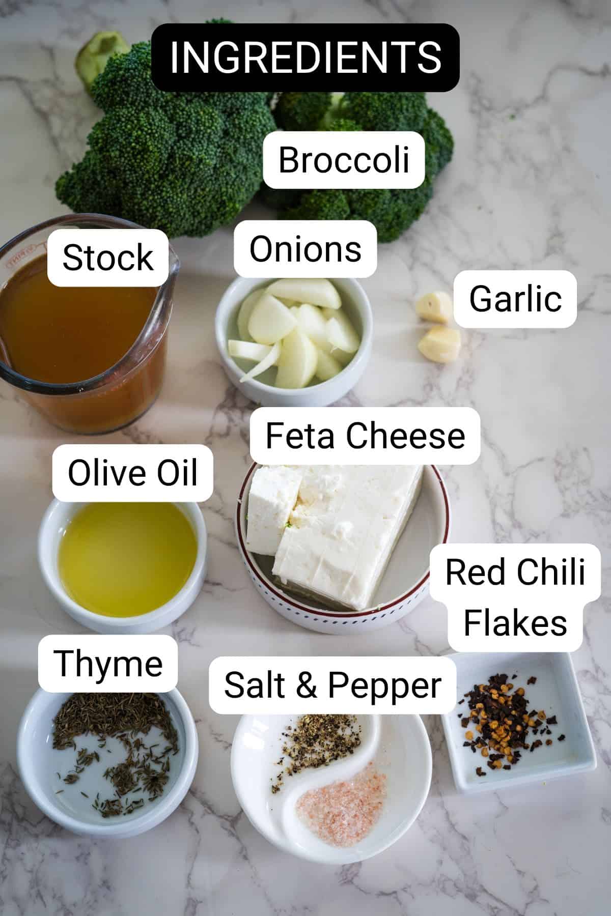 Ingredients on a marble surface include broccoli, onions, garlic, stock, feta cheese, olive oil, red chili flakes, thyme, salt, and pepper, with each item labeled.