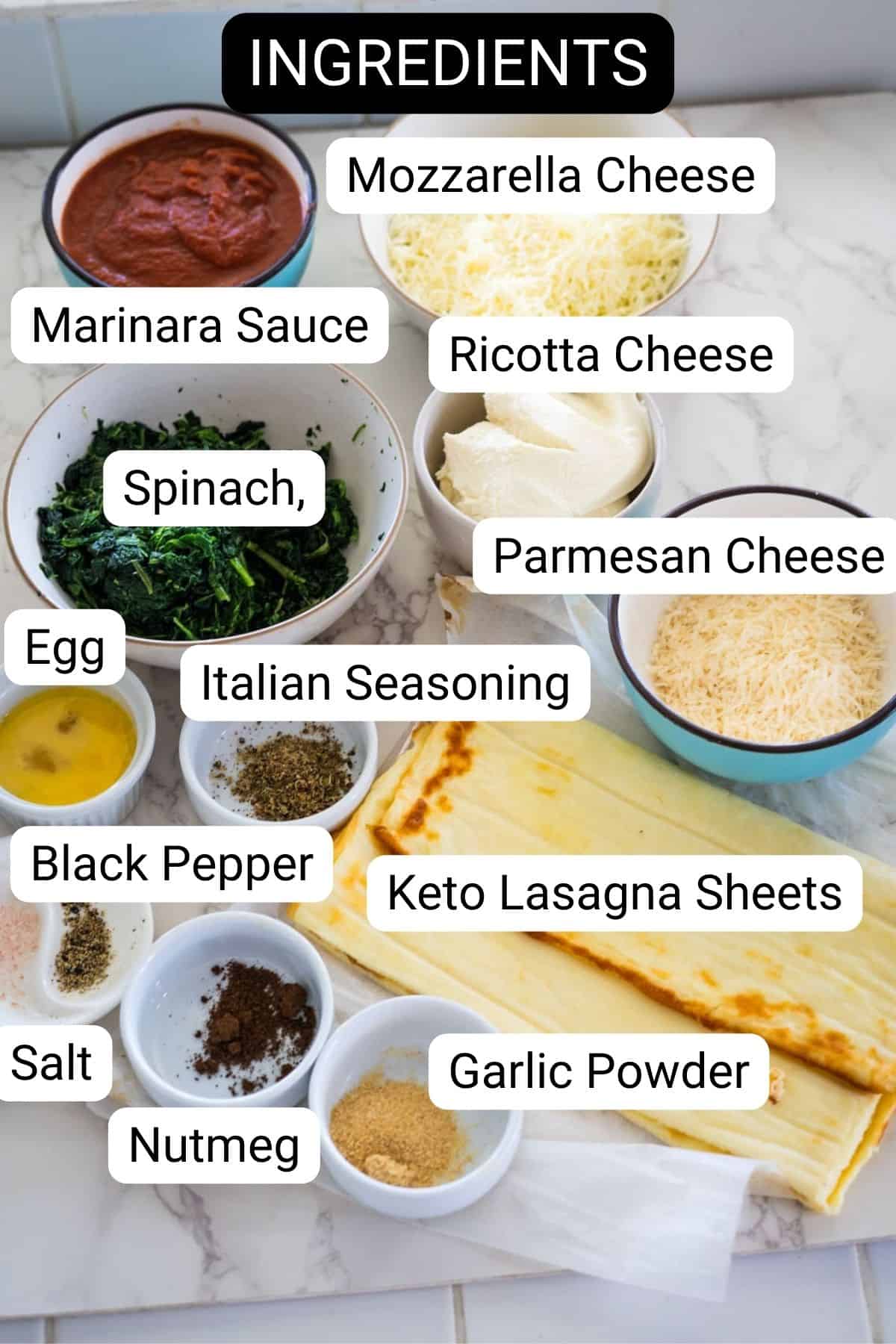 Ingredients for keto lasagna include mozzarella cheese, ricotta cheese, marinara sauce, spinach, parmesan cheese, egg, Italian seasoning, black pepper, salt, nutmeg, garlic powder, and sheets.